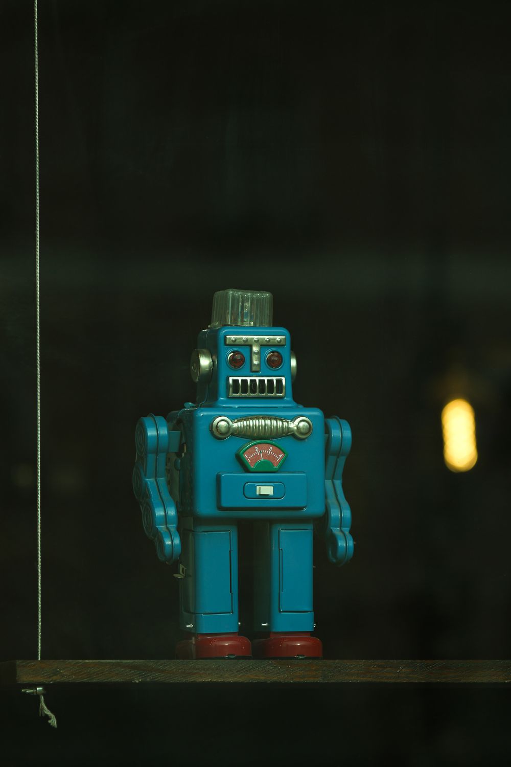 A vintage tin wind-up robot toy