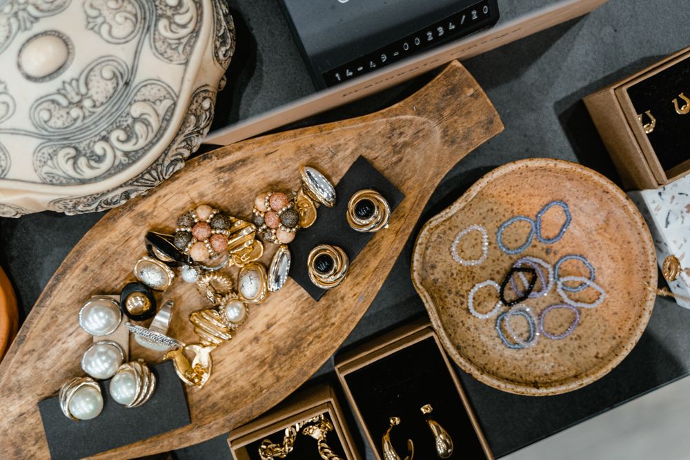 An assortment of vintage and costume jewelry in trays
