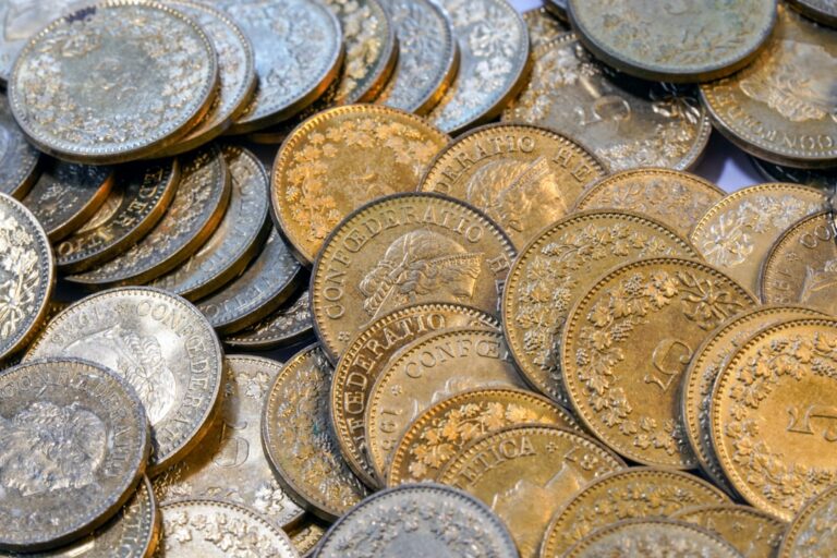 A pile of old gold and silver coins