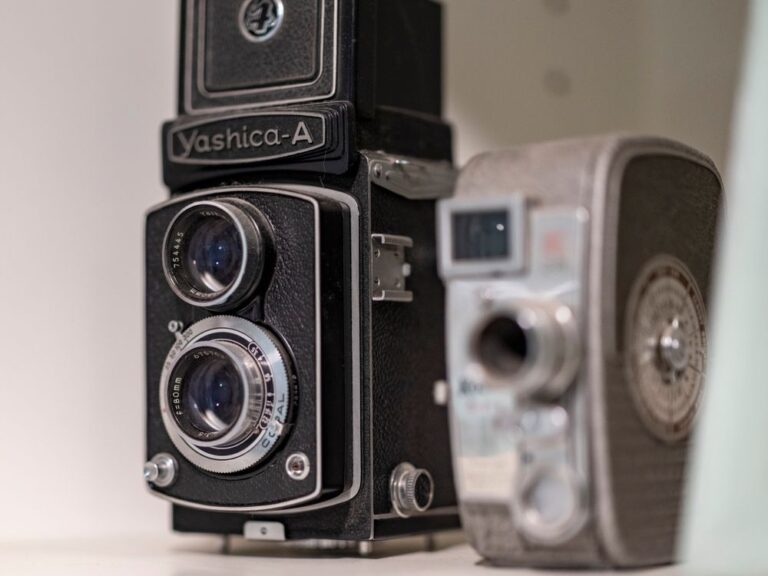 Vintage cameras displayed on a shelf