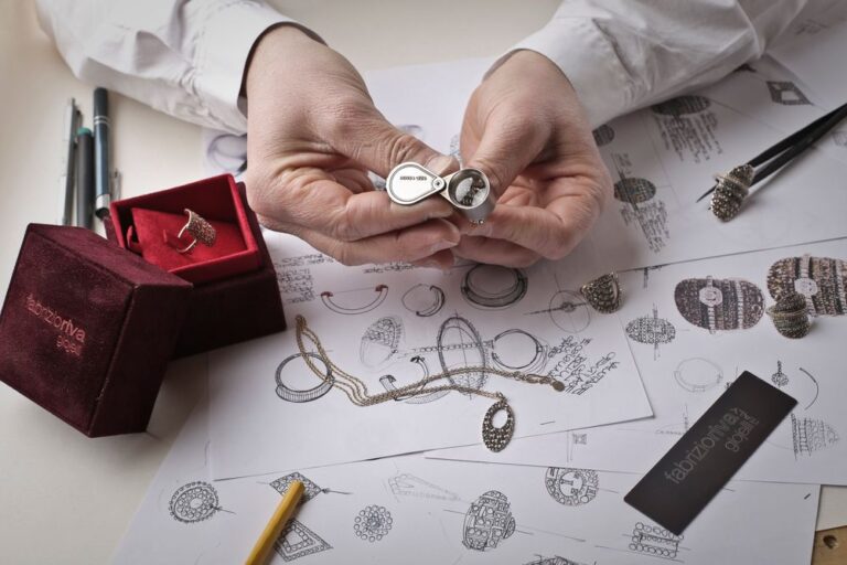 Examining a ring with a jeweler's loupe