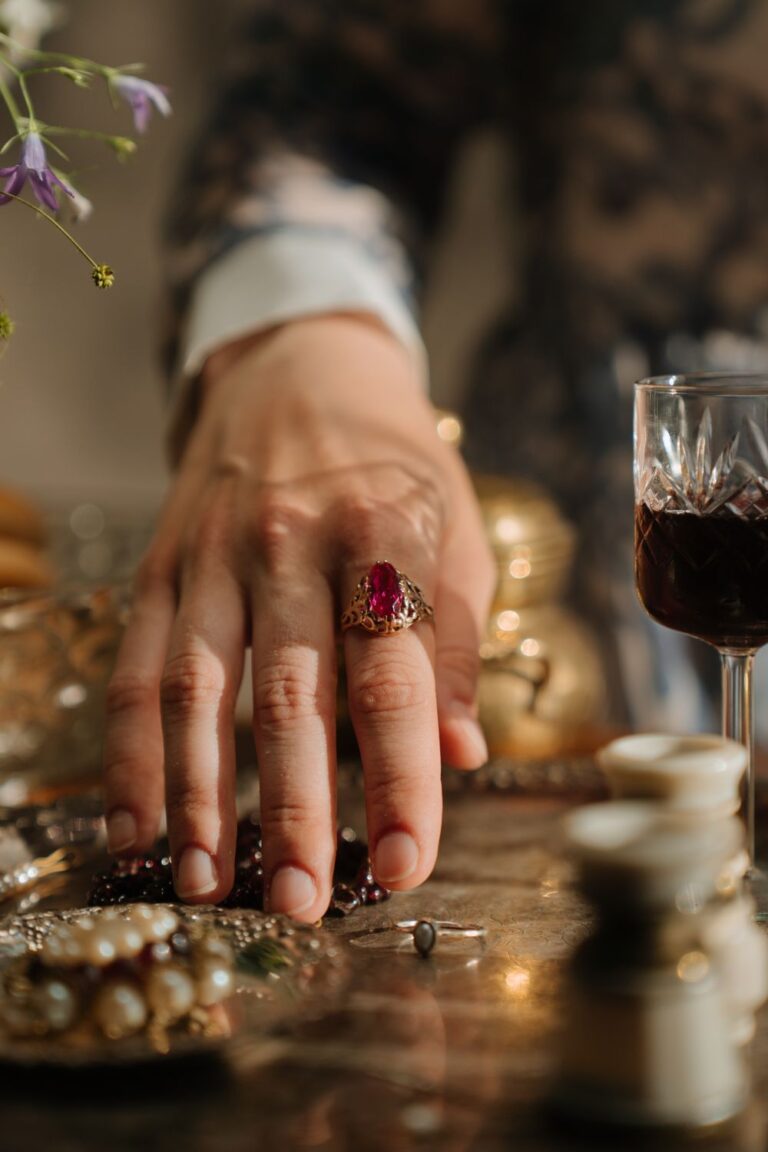 A vintage gold ring with a red gemstone