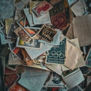 A jumbled pile of vintage postage stamps