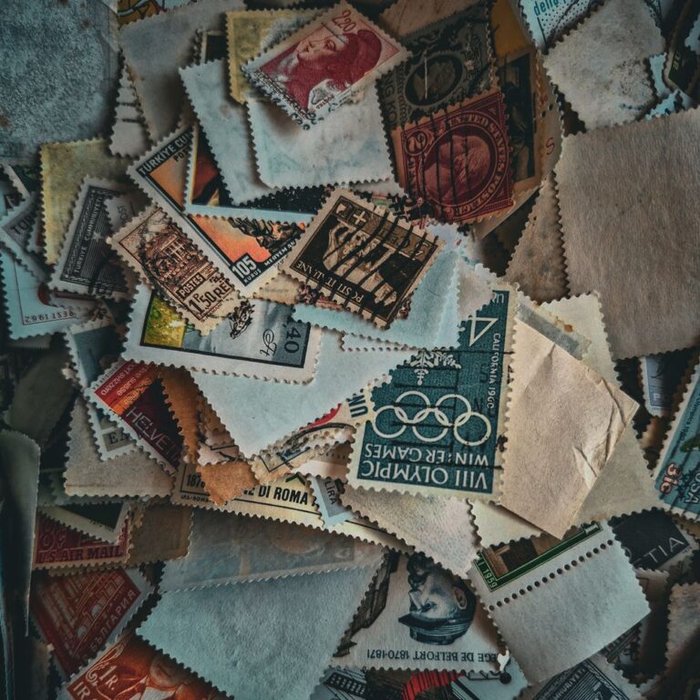 A jumbled pile of vintage postage stamps